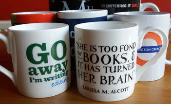 Photograph of several mugs with writing on them